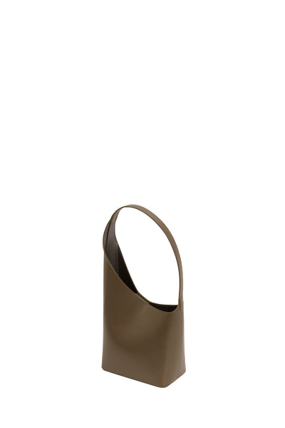 Aesther Ekme Demi Lune Assymetrical Brick Bucket Bag on model  02PF19DLL02127 - i-D Concept Stores